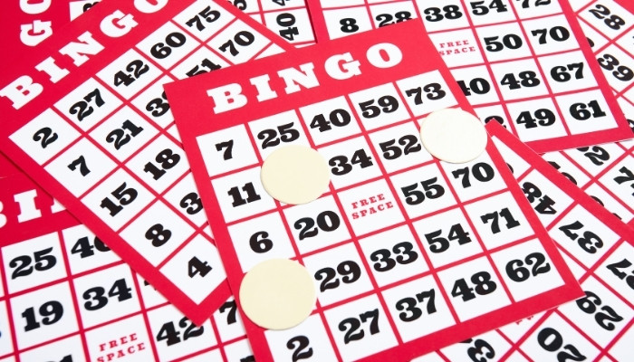Several red and white bingo cards overlapped at Silver Spike Bar & Grill Dilworth Minnesota Restaurant.
