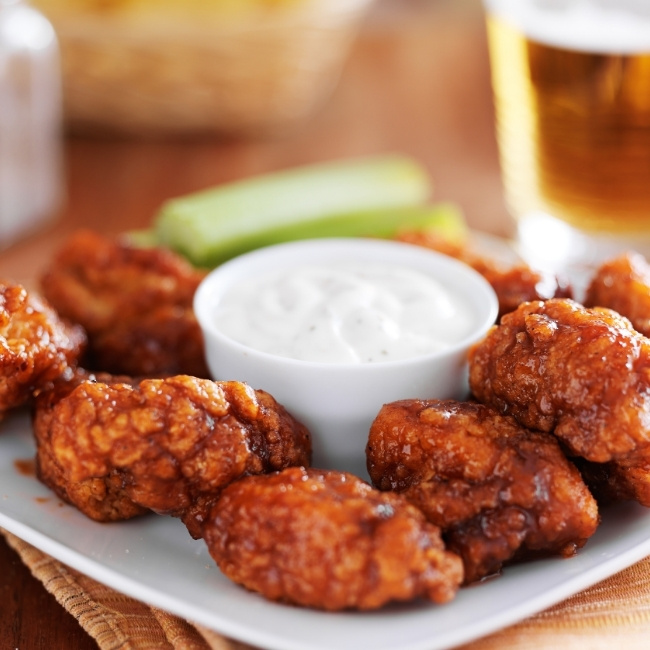 Plate of saucy chicken wings at Silver Spike Bar & Grill, Dilworth Minnesota Restaurant.
